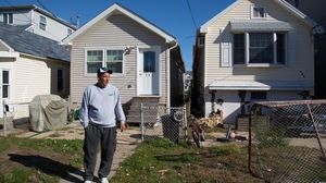 Stephen Drimalas stands outside his former home in Staten Island's Ocean Breeze neighborhood. He rebuilt his home after Hurricane Sandy but recently decided to sell it to the state.