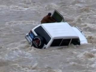 Watch Rescuers Pull Flood-Stranded Driver to Safety 