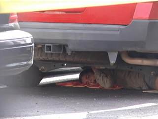 Women Crawl Under Truck in Border Patrol Protest