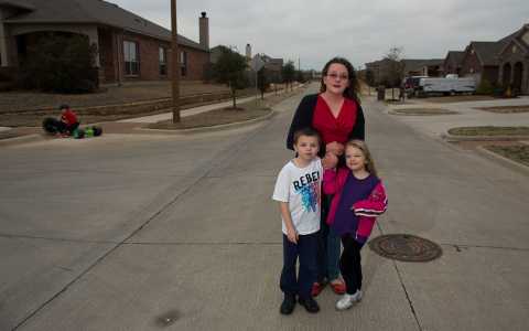Maile Bush with her children Kaden and Cassidy. Two wells have been fracked less than a hundred feet from their house.