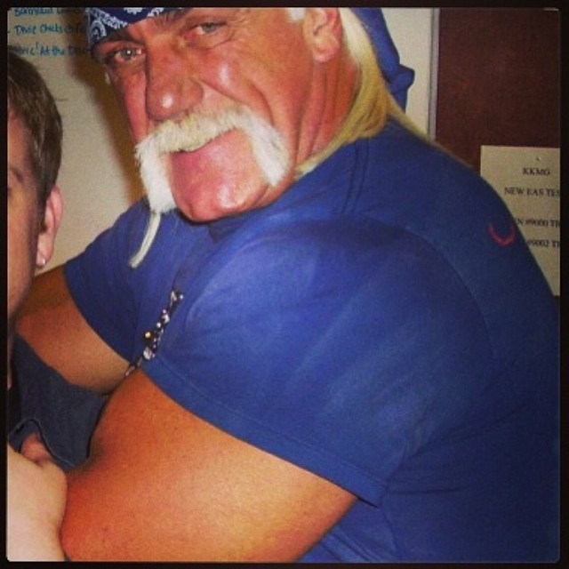 Which KVIL DJ does Hulk Hogan have locked in a sleeper in this #TBT pic!? Find out at KVIL.com!