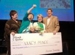 Nancy Prince, second from left, reacts as she and Linda French win the $10,000 Handi Quilter Best of Show Award at the International Quilt Festival. Brenda Groelz, from left, Nancy Prince, Linda French and Darren Denning. Groelz and Denning presented the award.  (For the Chronicle/Gary Fountain, October 28, 2014)