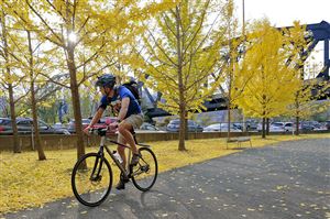  A bicyclist cruises down the Eliza Furnace section of the Three Rivers Heritage Trail near Grant Street, Downtown.
