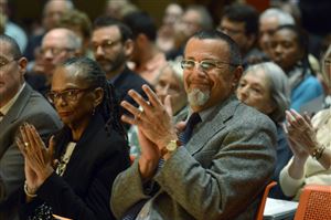  Linda Lane, left, superintendent of Pittsburgh Public Schools, and Richard Wertheimer, founder of City Charter High School, applaud keynote speaker Howard Fuller of the Institute for the Transformation of Learning, Marquette University, before a panel discussion about equity and excellence in education. 