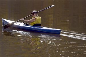  Robin Alexander of the North Side glides her kayak across North Park Lake.