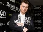 Awesome foursome: Sam Smith shows off his awards