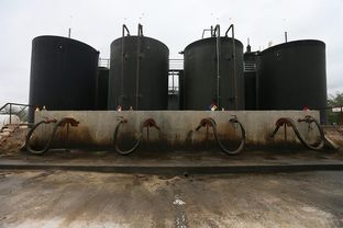 Each day, dozens of trucks hook up to the Gulf Coast-run fracking fluid disposal well site near Gonzales, Texas.