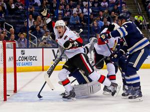 28 October 2014: Kyle Turris #7 of the Ottawa Senators celebrates after Clarke MacArthur #16 of the Ottawa Senators redirected a shot past Curtis McElhinney #31 of the Columbus Blue Jackets for a goal during the first period at Nationwide Arena in Columbus, Ohio