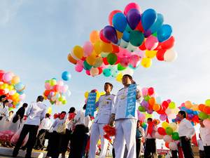 29 October 2014: Cambodian government officials hold balloons during a ceremony in Phnom Penh, Cambodia. Cambodia marks the 10th anniversary of coronation day of King Norodom Sihamoni