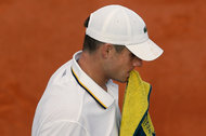 John Isner during a five-set loss in last year’s French Open. “You go to the towel to think about things,” a player says.