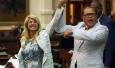 State Sen. Jose Rodriguez, D-El Paso, celebrates with the Forth Worth Democrat after her filibuster to defeat the anti-abortion bill SB5, up for a vote on the last day of the legislative special session June 25, 2013.