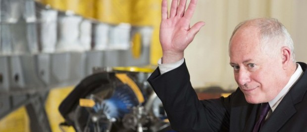 Governor of Illinois Pat Quinn waves as he is introduced by U.S. President Barack Obama during an event on manufacturing innovation institutes in the East Room of the White House