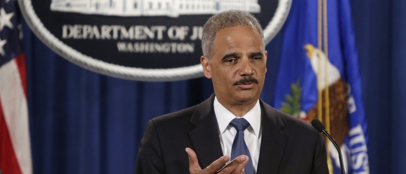 United States Attorney General Holder answers a question at news conference announcing updates on investigation of Brown shooting in Ferguson Missouri, in Washington
