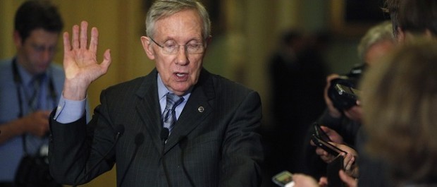 Reid speaks to reporters after the weekly party caucus luncheon at the U.S. Capitol in Washington