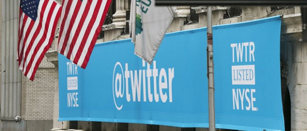 A sign displays the Twitter logo on the front of the New York Stock Exchange ahead of the company's IPO in New York