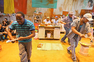 'Generations': Debbie Tucker Green’s short, gut-grabbing play brings us into a humble South African kitchen, where three generations of family tease and squabble over the subject of cooking. (Choir members, in the foreground, flank Ntombikhona Dlamini, center left, and Thuli Dumakude.) Deceptive in its simplicity, the play, beautifully acted and directed with stealthy smarts by Leah C. Gardiner, packs a huge emotional punch (:30). Soho Rep, 46 Walker Street, near Church Street, TriBeCa, 866-811-4111, sohorep.org. (Charles Isherwood)