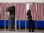 PHOTO: Two voters enter their booths to vote at Londonderry High School for the Republican New Hampshire primary election, Jan. 10, 2012 file photo.