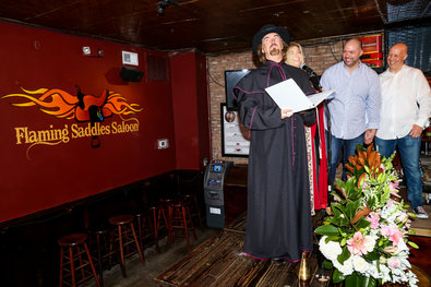 From left, Chris Barnes, Jacqui Squatriglia, Robert A. Beattey Jr. and Thomas E. Corcoran IV. Mr. Barnes and Ms. Squatriglia, who own the Flaming Saddles bar, officiated.