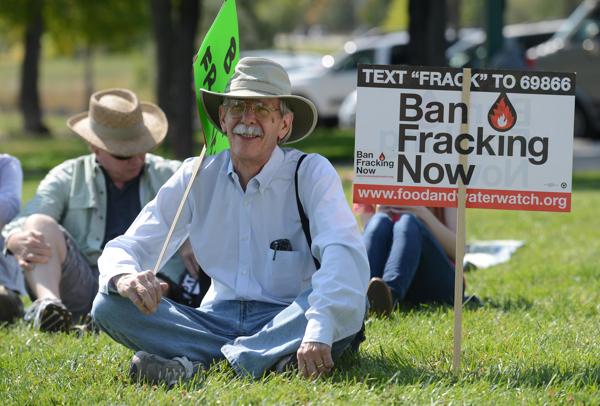 Jeff Olson, of Boulder, listens to a speaker during a fracking protest in Longmont in 2012.