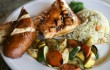 Offerings like the grilled chicken plate with house sage butter, rice pilaf, and veggies prove that there’s more to Dalton’s Corner than foot-high beers. Lee Chastain