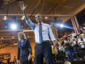 Mary Burke, the Democratic candidate for governor in Wisconsin, and President Obama leave the stage after a rally at North Division High School on Wednesday in Milwaukee.