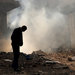A man walked in front of a burning building after a Syrian Air Force strike in Damascus in January.