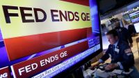 Fed ends bond buying and cites brighter job market - Photo