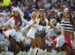 New England Patriots cheerleaders, dressed in costumes to commemorate Halloween, perform on the field during the first half of an NFL football game against the Chicago Bears, on Sunday, Oct. 26, 2014, in Foxborough, Mass. (AP Photo/Steven Senne)