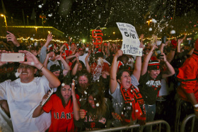 Fans celebrate after the San Francisco Giants defeated the Kansas City Royals to win the World Series during a television viewing event at the Civic Center in San Francisco