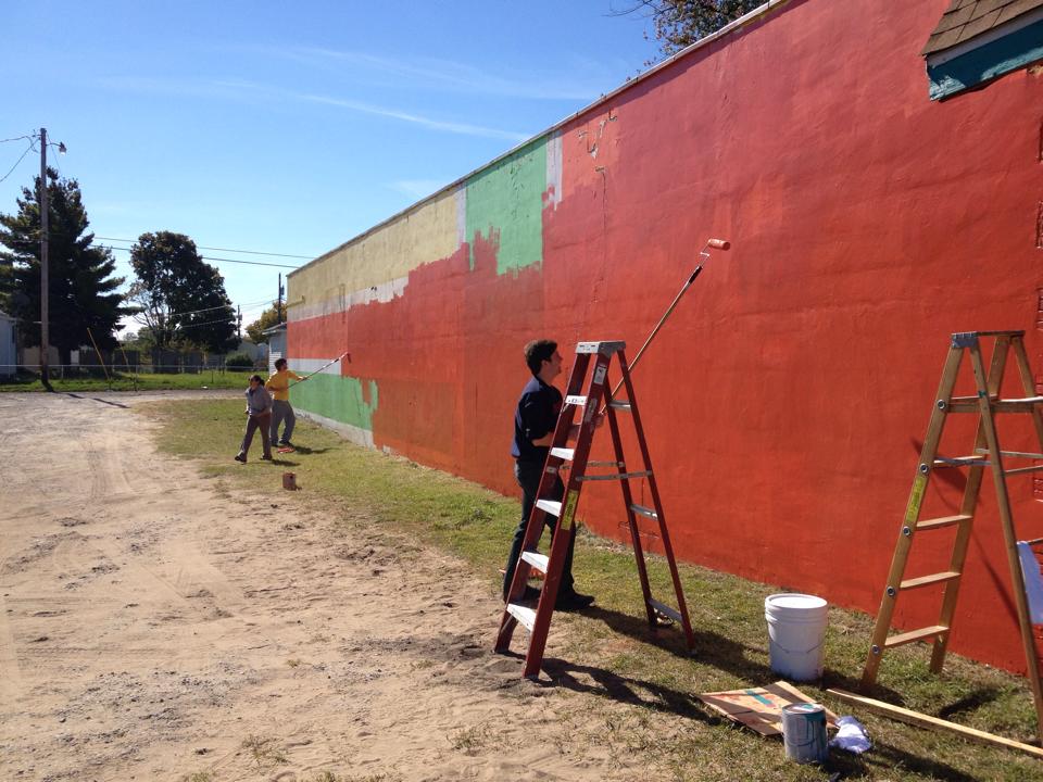 The community came together to re-paint blighted buildings along Western Avenue. Source: South Bend Better Block Facebook page