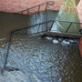 Water filled the stairs to a parking structure adjacent to the main entry doors of Pauley Pavilion, home of UCLA basketball, after a 30-inch water main burst on nearby Sunset Boulevard Tuesday.