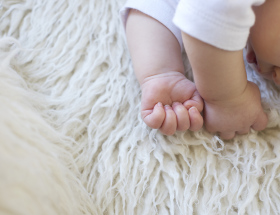 Baby on fur rug