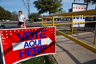 Vote signs outside early voting locations in Austin on Feb. 23, 2014.