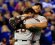 Buster Posey #28 and Madison Bumgarner #40 of the San Francisco Giants celebrate after defeating the Kansas City Royals to win Game Seven of the 2014 World Series by a score of 3-2 at Kauffman Stadium on October 29, 2014 in Kansas City, Missouri. (Photo by Jamie Squire/Getty Images)