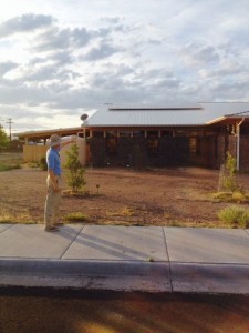 Bennett Jones points to the solar panels he helped design for Alpine Public Library.