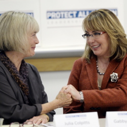 Julia Colpitts, executive director of the Maine Coalition to End Domestic Violence, left, and former Democratic U.S. Rep. Gabby Giffords of Arizona share a moment during Gifford’s visit to the University of Southern Maine as part of her Protect All Women Tour this month.
