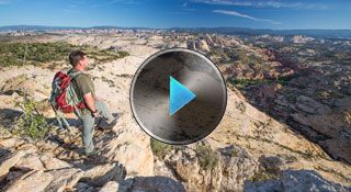 Photo of man overlooking landscape -- links to video