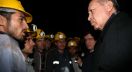 In this photo provided by the Presidential Press Service, Turkey's President Recep Tayyip Erdogan speaks with miners on the second day after underground waters flooded a section of a coal mine in the town of Ermenek, some 500 kilometers (300 miles) south of Ankara, close to Turkey’s Mediterranean coast, Wednesday, Oct. 29, 2014. At least 18 workers were trapped inside, officials and reports said _ an event likely to raise even more concerns about the nation’s poor workplace safety standards. In May, a fire inside a coal mine in the western town of Soma killed 301 miners in Turkey’s worst mining disaster. The fire exposed poor safety standards and superficial government inspections in many of the country's mines.