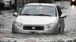 A car crossing a flooded street Buenos Aires, Argentina, on 29 October 2014. 