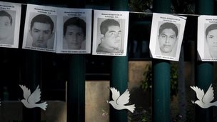 Images of the missing 43 rural college students hang on the front gate of the Mexican attorney general's office in Mexico City, Wednesday, Oct. 29, 2014. 