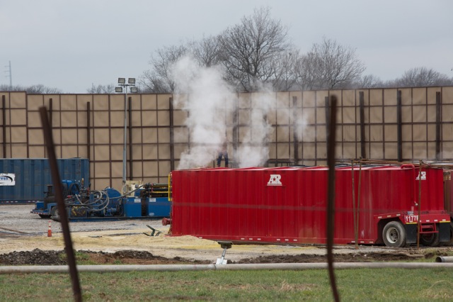 Smoke rises during flowback at an EagleRidge hydraulic fracturing site that is approximately 200 feet from a housing development in Denton, <span class="caps">TX</span>. ©2014 Julie Dermansky