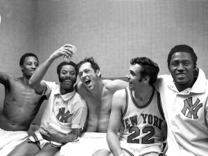 The New York Knicks' starting five on April 20, 1970 -- from left: Dick Barnett, Walt Frazier, Bill Bradley, Dave DeBusschere and Willis Reed  -- rejoice in the dressing room after winning their fifth playoff game against the Milwaukee Bucks, 132-96, and with it their first National Basketball Association Eastern Conference title since 1953.