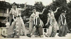 The author's mother, Reba Roy (far left), dancing on stage in a sari as a young woman.