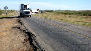 A natural gas drilling boom in the Eagle Ford Shale area in South Texas is straining the area's rural roads as more than 1,000 loaded trucks are needed to bring a single well into production.