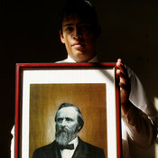 Paraguayan government employee Daniel Alonso holds a portrait of Rutherford B. Hayes at the government building in Villa Hayes, the Paraguayan town named after the 19th U.S. president. Hayes is revered for a decision that gave the country 60 percent of its present territory.