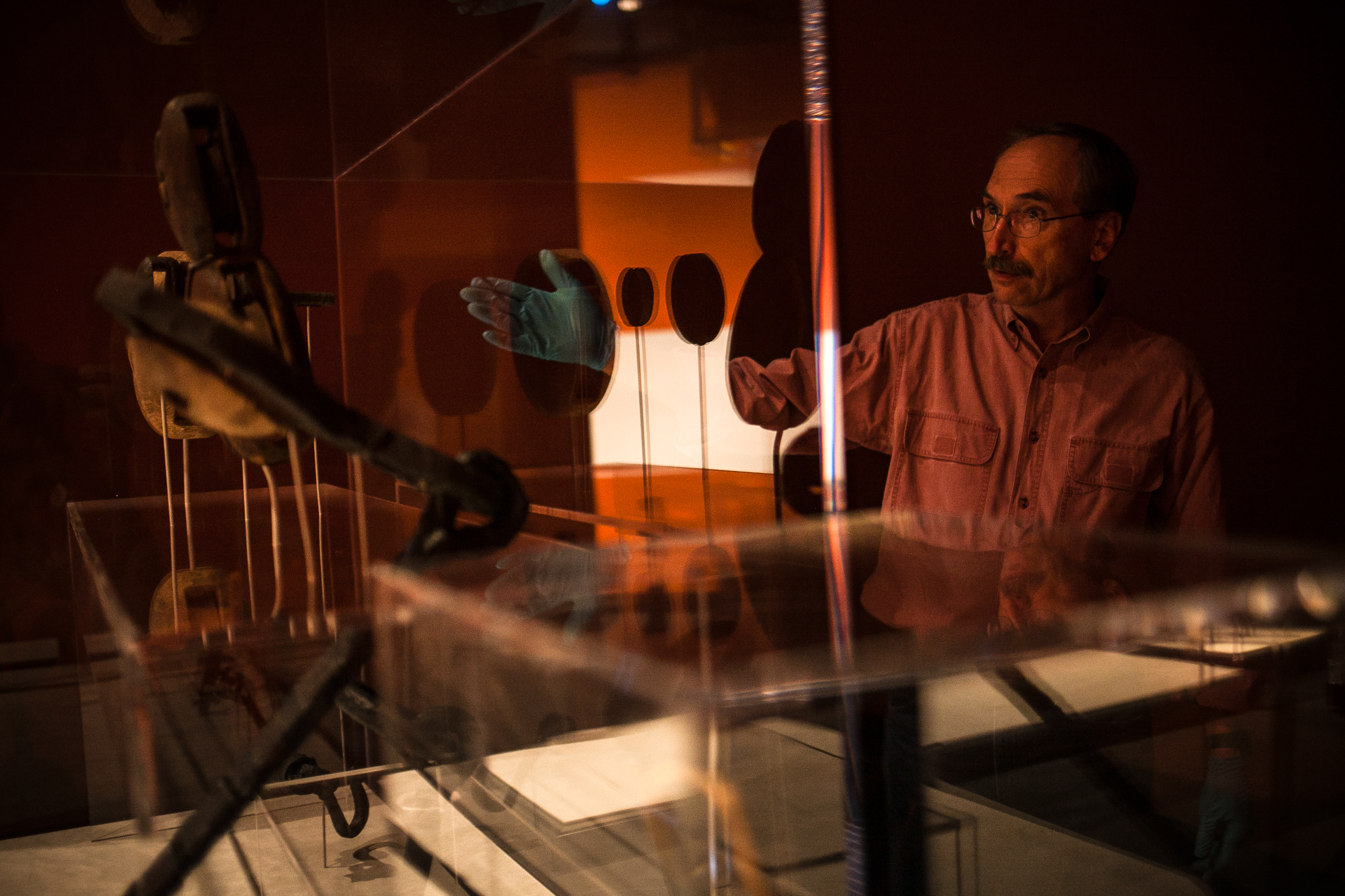 Dr. James Bruseth, guest curator at the Bullock Texas State History Museum, points out some of the tools recovered from the  La Belle that will be on display at the museum in Austin, TX., during a tour on October 15, 2014.