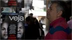 Man looking at Brazil Electoral poster