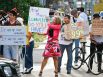 Laura Haley (center) holds a sign as she and other protestors with the Occupy Houston movement, an outgrowth of the Occupy Wall Street protests in New York, march to City Hall as they gathered in downtown Houston to denounce what they describe as social and economic equality and corporate greed, Thursday, Oct. 6, 2011, in Houston.