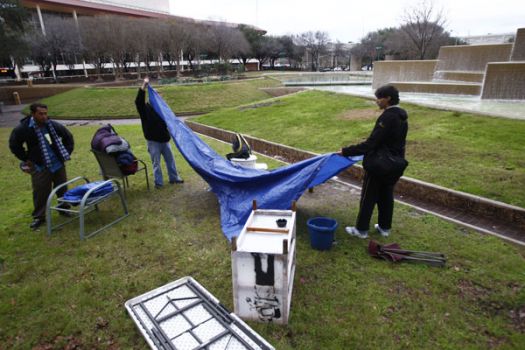 Occupy Houston protesters pack up their site in Tranquillity Park before sundown Monday. (Michael Paulsen / Chronicle) Photo: Michael Paulsen, Houston Chronicle / Houston Chronicle