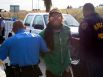 An Occupy Houston protestor is arrested after laying in the exit ramp of Loop 610 at the Port of Houston Authority Monday, Dec. 12, 2011, in Houston.